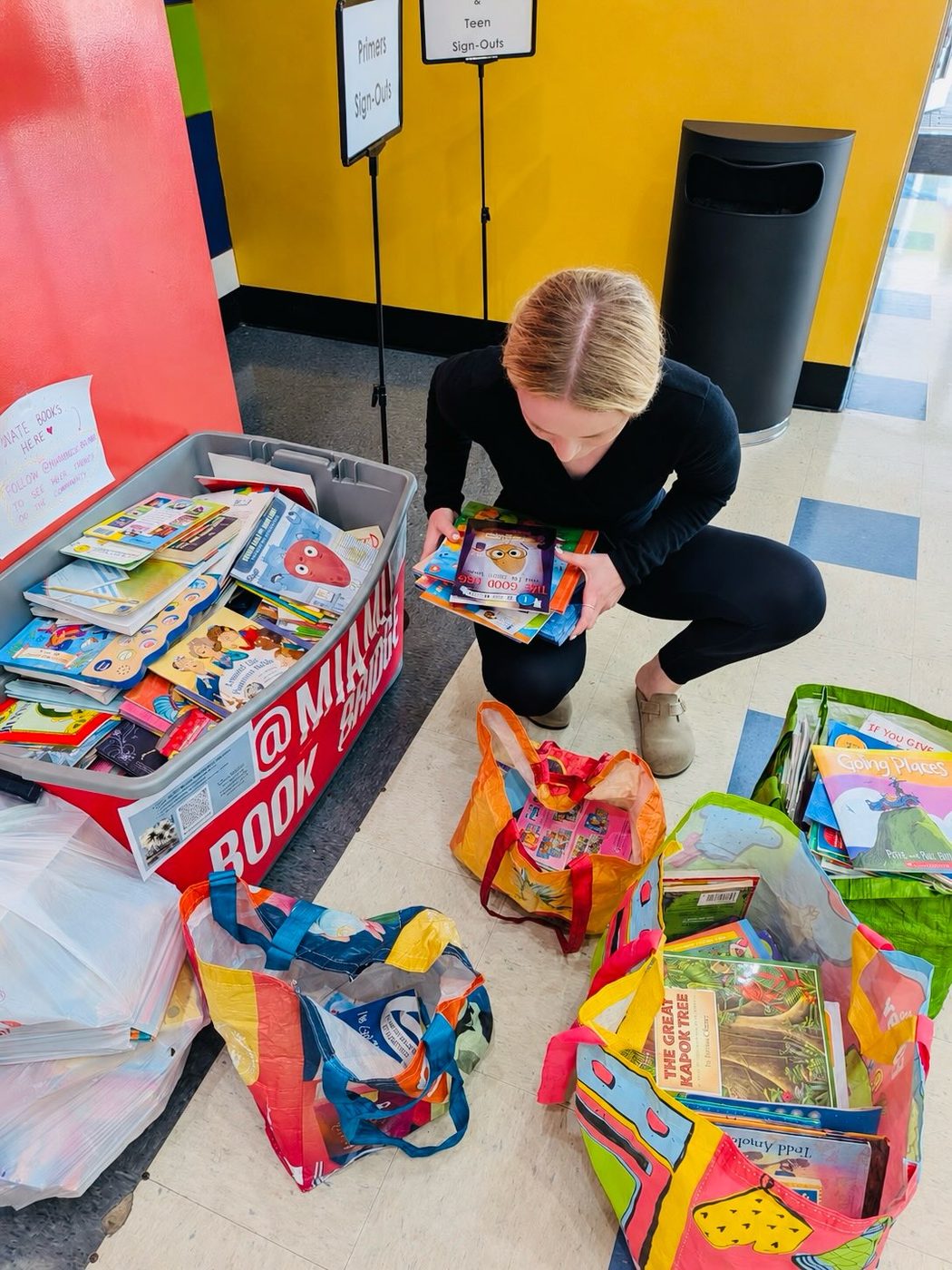 Collecting books from the red Miami Book Bridge drop box at the Scott Rakow Youth Center